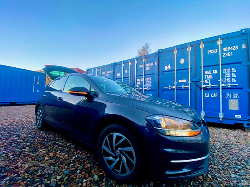 Car unloading on a shipping self storage facility